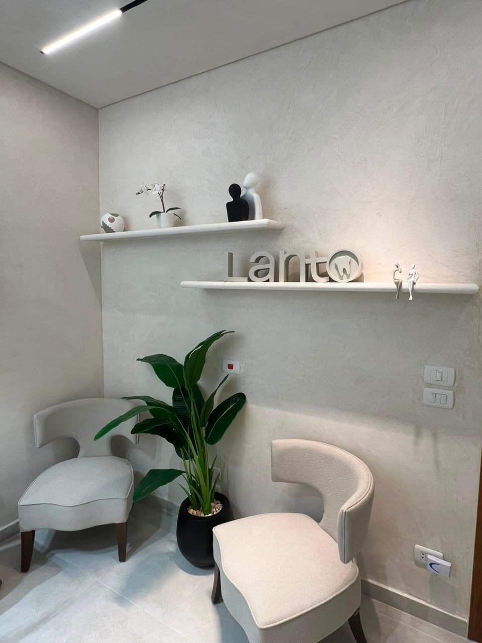 Lant clinic waiting area with branded shelves and seating